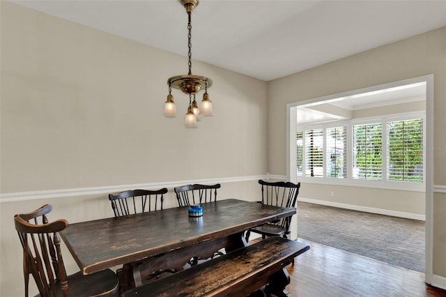 991 Hawthorne Cove Ct, Ocoee, FL 34761 - dining space with wood finished floors and a chandelier