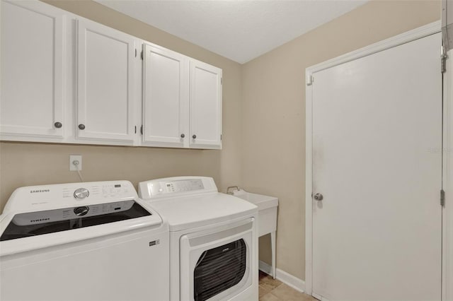 991 Hawthorne Cove Ct, Ocoee, FL 34761 - laundry area with cabinet space, separate washer and dryer, and light tile patterned flooring