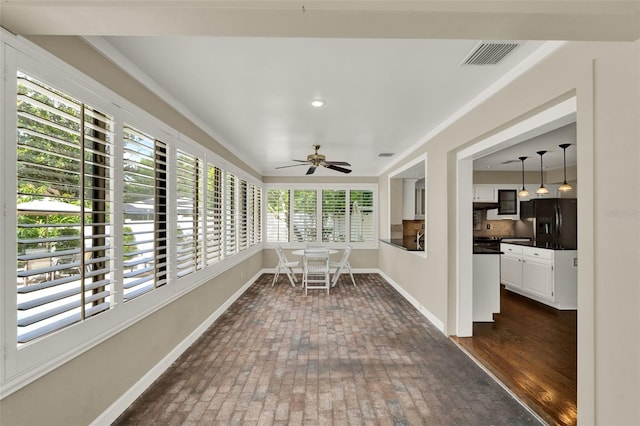 991 Hawthorne Cove Ct, Ocoee, FL 34761 - sunroom / solarium with brick floors and baseboards