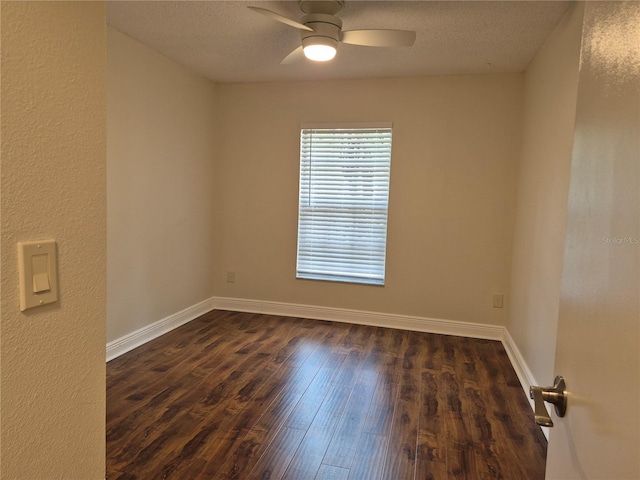 13546 Summerton Dr, Orlando, FL 32824 - empty room with a ceiling fan, dark wood-style floors, and a textured ceiling
