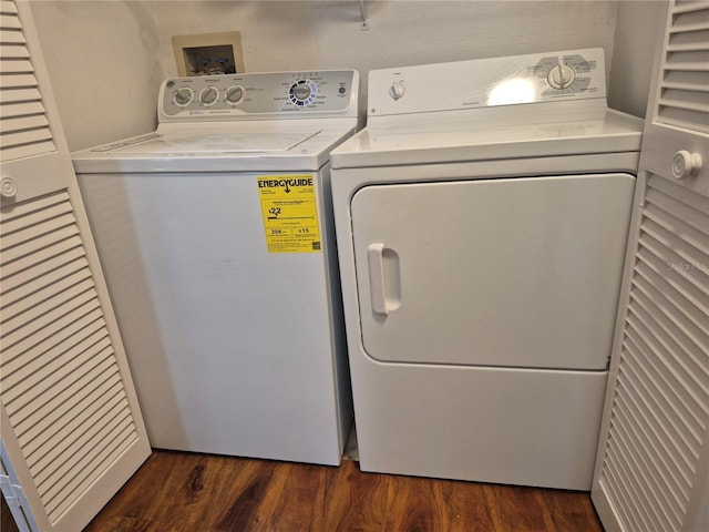 13546 Summerton Dr, Orlando, FL 32824 - laundry area with washing machine and clothes dryer and dark wood-style floors