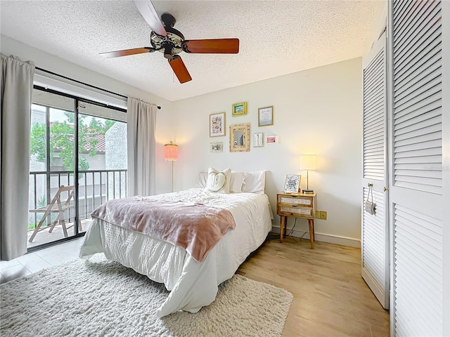 260 Killarney Bay Ct Unit 6-6, Winter Park, FL 32789 - bedroom with access to exterior, a textured ceiling, light wood-style floors, and a ceiling fan