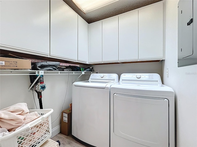 260 Killarney Bay Ct Unit 6-6, Winter Park, FL 32789 - laundry room with separate washer and dryer, electric panel, cabinet space, and light wood-style floors
