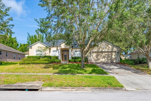 3954 Old Dunn Rd, Apopka, FL 32712 - view of front facade with an attached garage, a front lawn, concrete driveway, and stucco siding