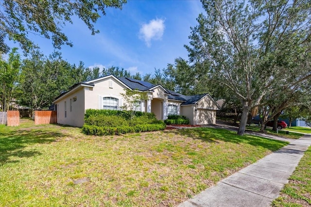 3954 Old Dunn Rd, Apopka, FL 32712 - ranch-style house with solar panels, a garage, and stucco siding
