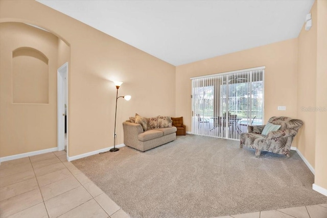 3954 Old Dunn Rd, Apopka, FL 32712 - living area with carpet floors, tile patterned flooring, and baseboards