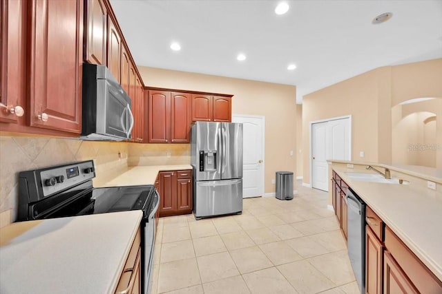 3954 Old Dunn Rd, Apopka, FL 32712 - kitchen with stainless steel appliances, light countertops, tasteful backsplash, a sink, and light tile patterned flooring