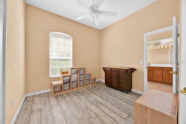 3954 Old Dunn Rd, Apopka, FL 32712 - empty room with light wood finished floors, a ceiling fan, and baseboards