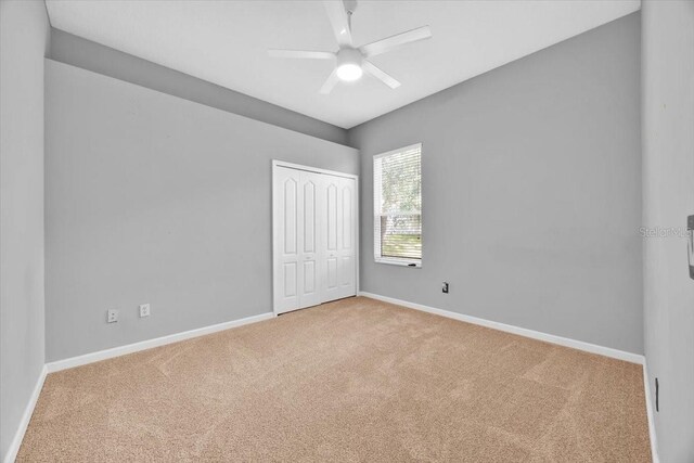 3954 Old Dunn Rd, Apopka, FL 32712 - unfurnished bedroom featuring carpet flooring, baseboards, and a closet