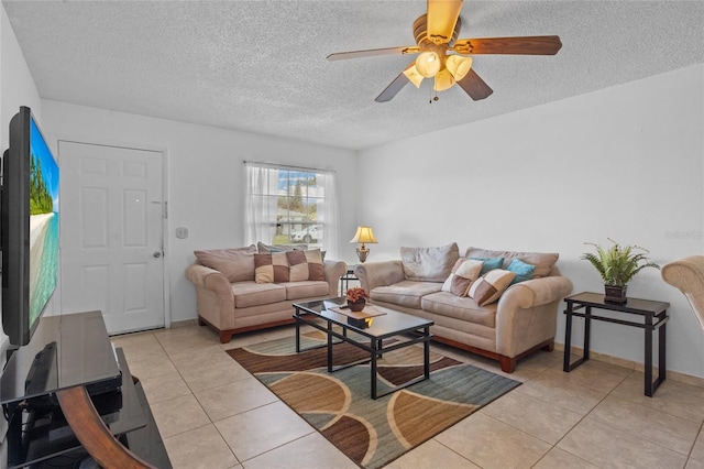 8116 Parrot Dr, Orlando, FL 32825 - living area featuring light tile patterned floors, a textured ceiling, and a ceiling fan
