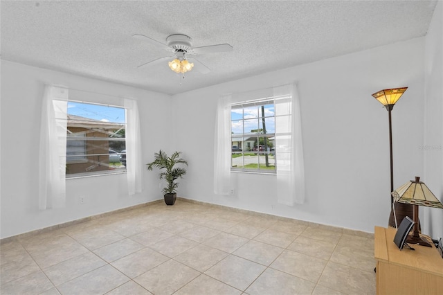 8116 Parrot Dr, Orlando, FL 32825 - empty room featuring plenty of natural light, a textured ceiling, and ceiling fan