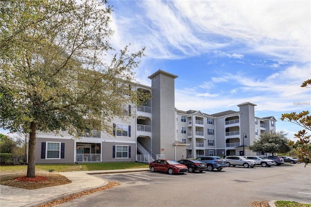 3176 Feltrim Pl Unit 302, Kissimmee, FL 34747 - view of apartment building / complex with uncovered parking