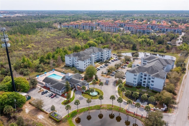 3176 Feltrim Pl Unit 302, Kissimmee, FL 34747 - drone / aerial view of a heavily wooded area and a nearby body of water
