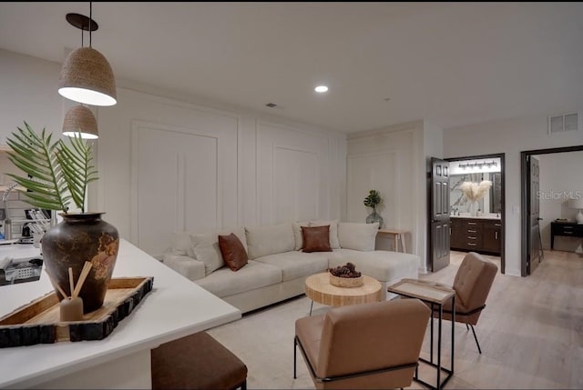 3176 Feltrim Pl Unit 302, Kissimmee, FL 34747 - living area featuring light wood-style floors and recessed lighting