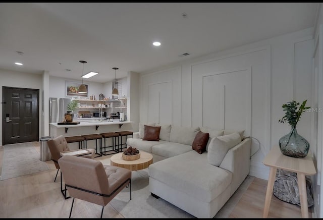 3176 Feltrim Pl Unit 302, Kissimmee, FL 34747 - living area with light wood finished floors and recessed lighting