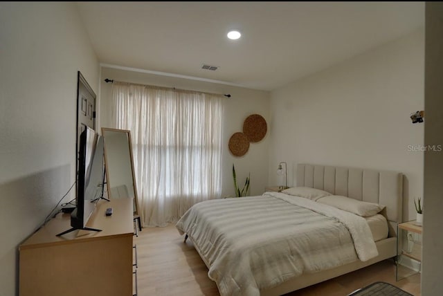 3176 Feltrim Pl Unit 302, Kissimmee, FL 34747 - bedroom featuring light wood-style flooring and recessed lighting