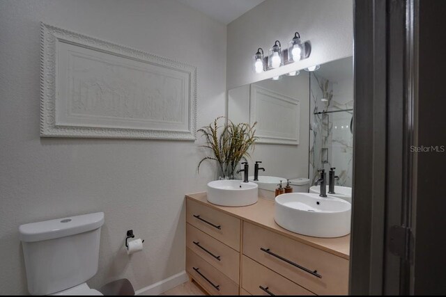 3176 Feltrim Pl Unit 302, Kissimmee, FL 34747 - full bathroom with a marble finish shower and double vanity