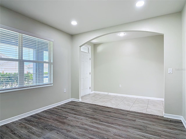 3975 Silverstream Ter, Sanford, FL 32771 - unfurnished room featuring arched walkways, wood finished floors, and recessed lighting
