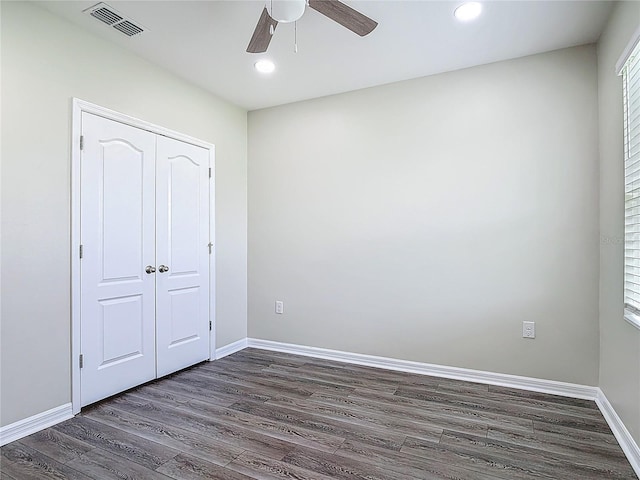 3975 Silverstream Ter, Sanford, FL 32771 - unfurnished bedroom with dark wood-style flooring, recessed lighting, a closet, and ceiling fan