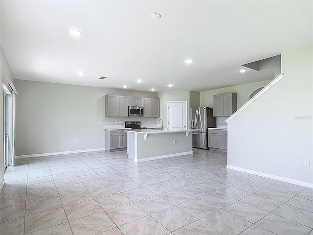 3975 Silverstream Ter, Sanford, FL 32771 - kitchen featuring gray cabinets, appliances with stainless steel finishes, recessed lighting, light countertops, and light tile patterned floors