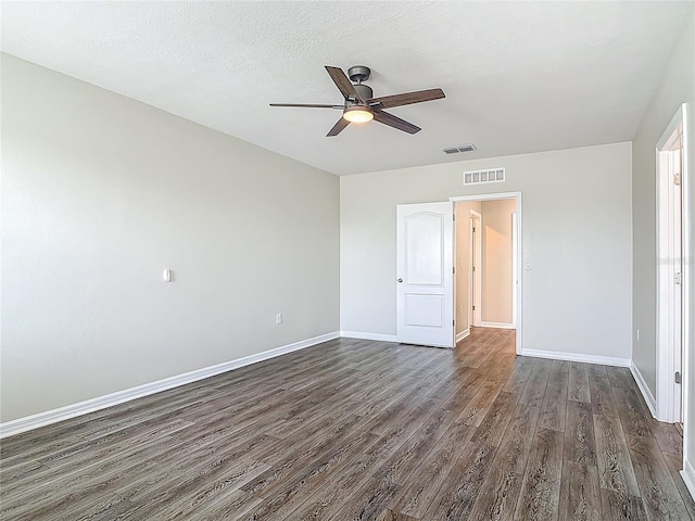 3975 Silverstream Ter, Sanford, FL 32771 - unfurnished bedroom featuring dark wood finished floors and a ceiling fan