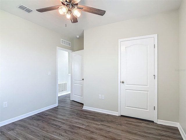 3975 Silverstream Ter, Sanford, FL 32771 - unfurnished bedroom featuring dark wood-style flooring and ceiling fan