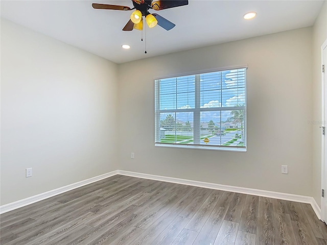 3975 Silverstream Ter, Sanford, FL 32771 - spare room with wood finished floors, a ceiling fan, and recessed lighting