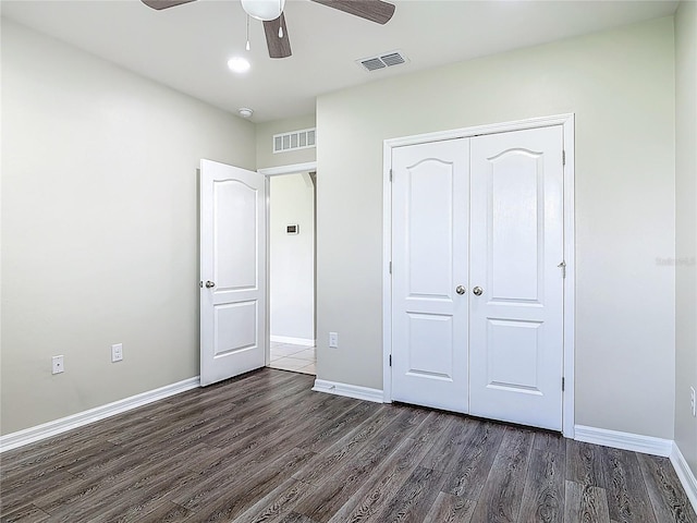3975 Silverstream Ter, Sanford, FL 32771 - unfurnished bedroom featuring dark wood-type flooring, a closet, and ceiling fan