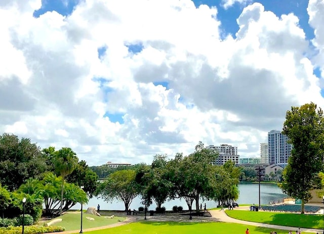 151 E Washington St Unit 508, Orlando, FL 32801 - view of property's community with a water view, a lawn, and a putting area