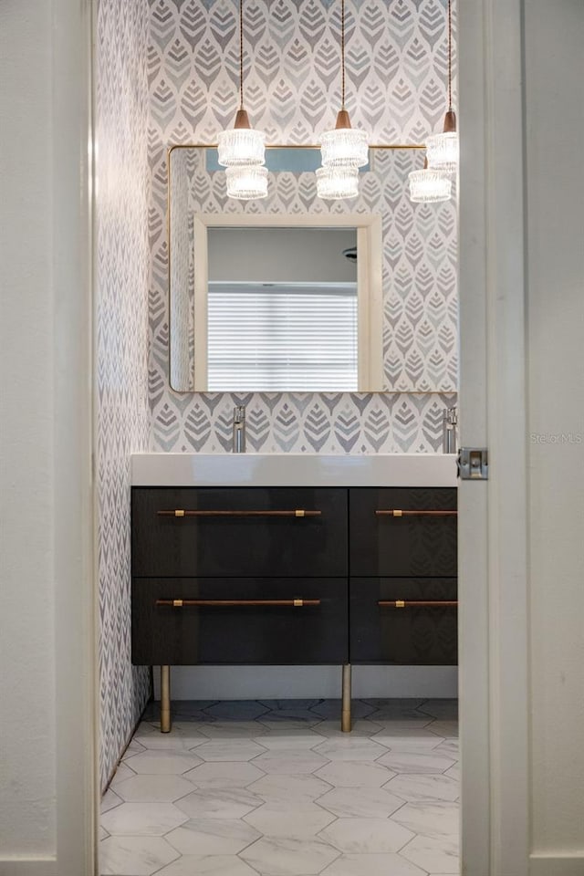 6047 Blakeford Dr, Windermere, FL 34786 - bathroom with wallpapered walls and vanity