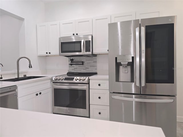 3030 Clubview Dr Unit Ge, Orlando, FL 32822 - kitchen featuring stainless steel appliances, light countertops, and white cabinets