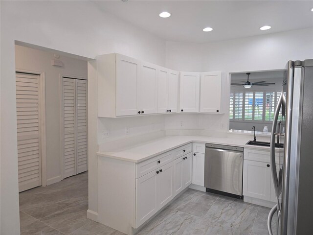 3030 Clubview Dr Unit Ge, Orlando, FL 32822 - kitchen with stainless steel appliances, ceiling fan, light countertops, white cabinetry, and recessed lighting