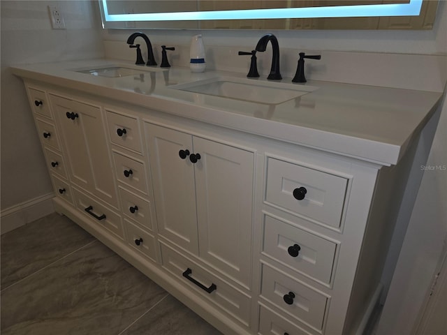 3030 Clubview Dr Unit Ge, Orlando, FL 32822 - bathroom featuring double vanity and baseboards