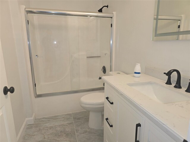 3030 Clubview Dr Unit Ge, Orlando, FL 32822 - bathroom featuring vanity, combined bath / shower with glass door, and marble look tiles