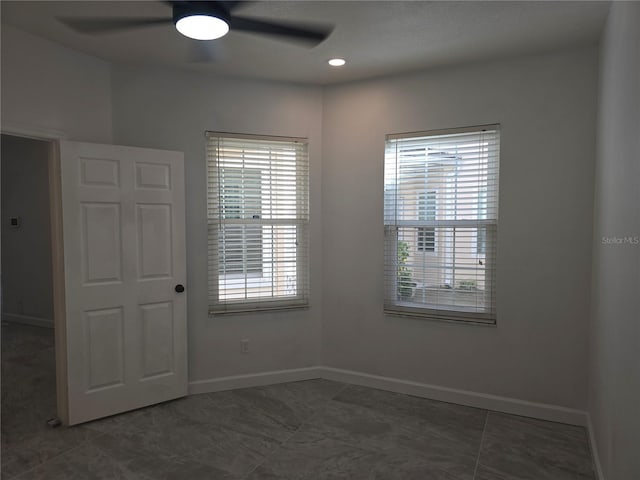 3030 Clubview Dr Unit Ge, Orlando, FL 32822 - spare room featuring a ceiling fan and baseboards