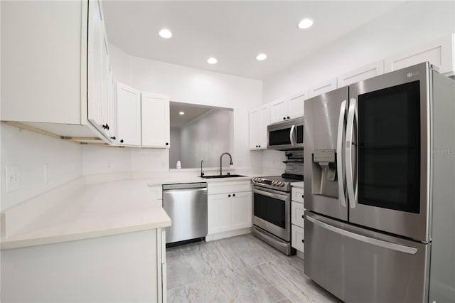 3030 Clubview Dr Unit Ge, Orlando, FL 32822 - kitchen with stainless steel appliances, light marble finish floors, white cabinetry, light countertops, and recessed lighting