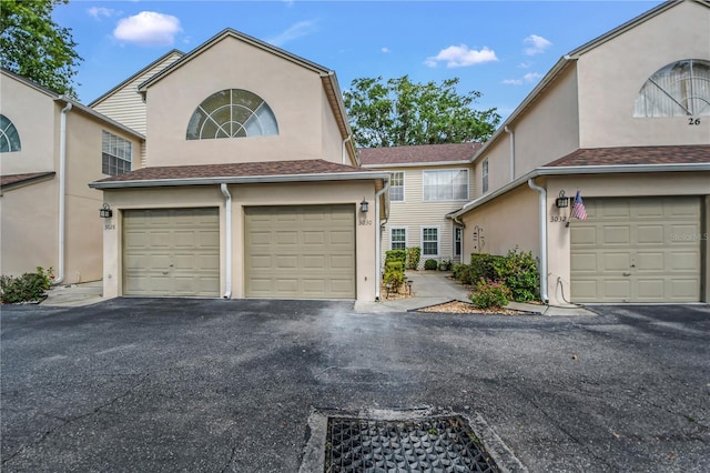 3030 Clubview Dr Unit Ge, Orlando, FL 32822 - view of front of house featuring stucco siding and driveway