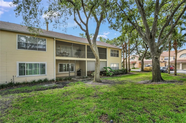 3030 Clubview Dr Unit Ge, Orlando, FL 32822 - rear view of property with a lawn