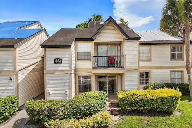 1924 Lake Atriums Cir Unit 52, Orlando, FL 32839 - view of front of property featuring a balcony and roof with shingles