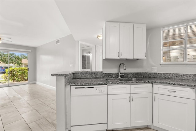 1924 Lake Atriums Cir Unit 52, Orlando, FL 32839 - kitchen featuring white dishwasher, dark stone counters, white cabinets, and a ceiling fan