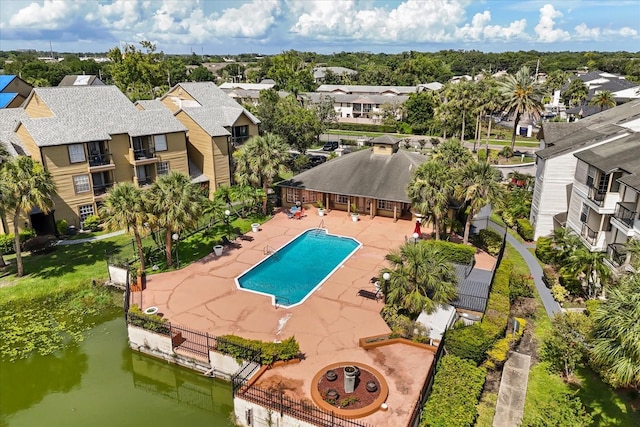 1924 Lake Atriums Cir Unit 52, Orlando, FL 32839 - community pool featuring a patio, a residential view, and a water view