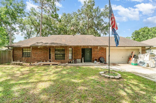 236 Longhorn Dr, Apopka, FL 32712 - ranch-style home featuring an attached garage, concrete driveway, brick siding, a porch, and roof with shingles