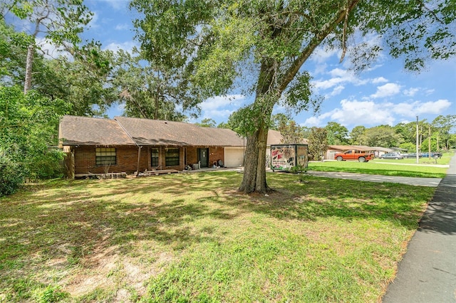236 Longhorn Dr, Apopka, FL 32712 - ranch-style home with an attached garage, a front yard, driveway, and a porch
