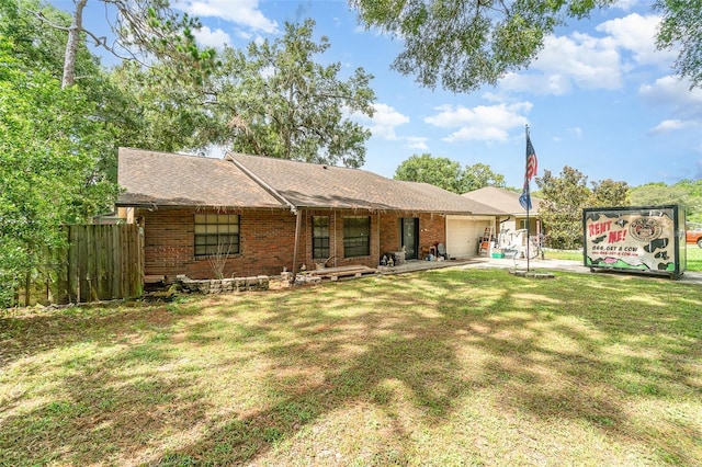 236 Longhorn Dr, Apopka, FL 32712 - ranch-style house featuring a garage, brick siding, roof with shingles, and driveway