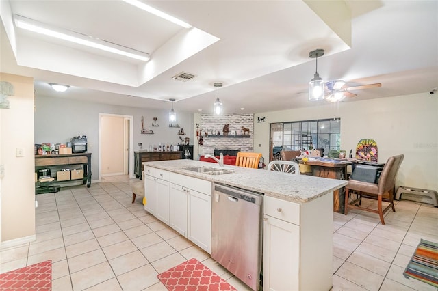 236 Longhorn Dr, Apopka, FL 32712 - kitchen with dishwasher, light tile patterned floors, ceiling fan, and white cabinets