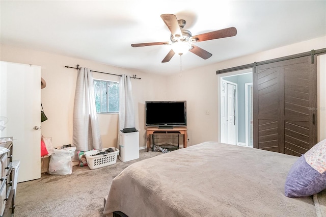 236 Longhorn Dr, Apopka, FL 32712 - bedroom with a barn door, carpet floors, and a ceiling fan
