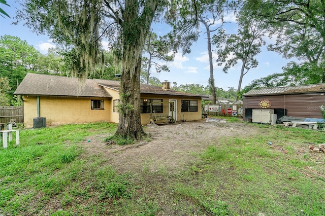 236 Longhorn Dr, Apopka, FL 32712 - rear view of house with a chimney and stucco siding