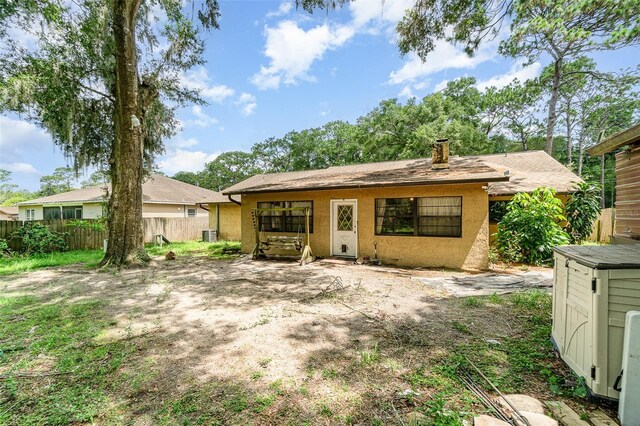 236 Longhorn Dr, Apopka, FL 32712 - rear view of property with stucco siding