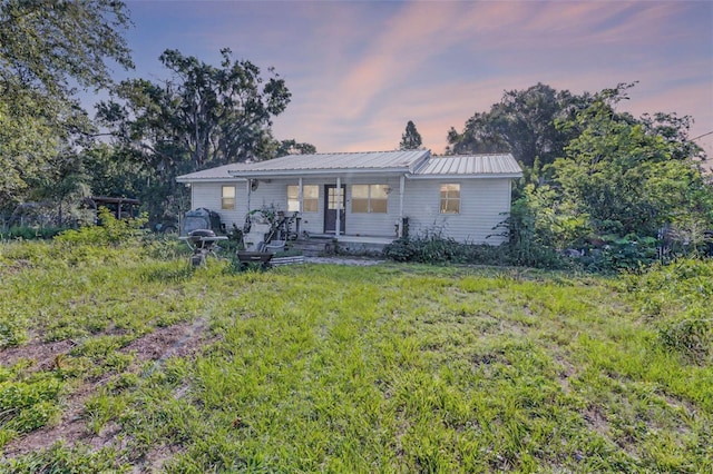 2915 Dean Ridge Rd, Orlando, FL 32825 - view of front of home with a porch and a metal roof