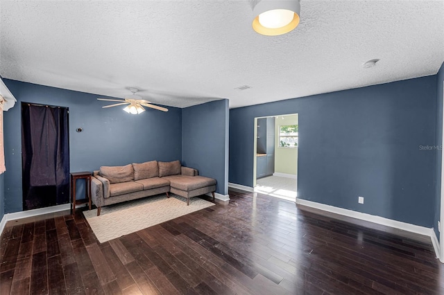 2915 Dean Ridge Rd, Orlando, FL 32825 - living area with wood finished floors, a ceiling fan, and a textured ceiling